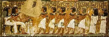 Illustration de Minhotep et son épouse (un cône parfumé sur leur tête) reçoivent des offrandes
